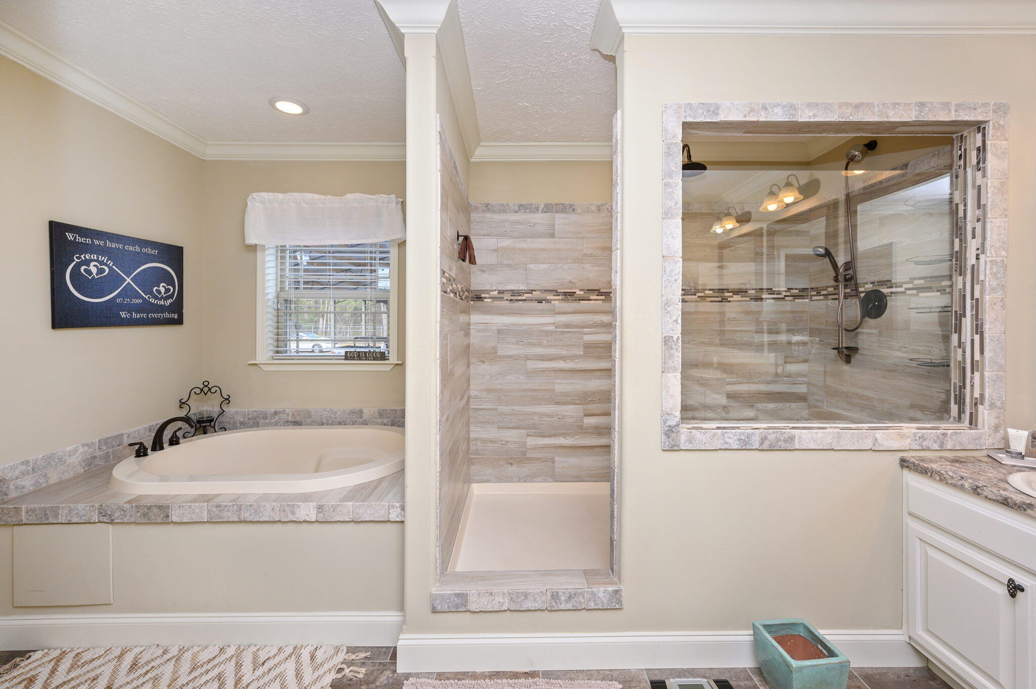 6019 Old River Road Baker, FL 32531 - Photo 21 of 54 a bathroom with a tub a sink and a window