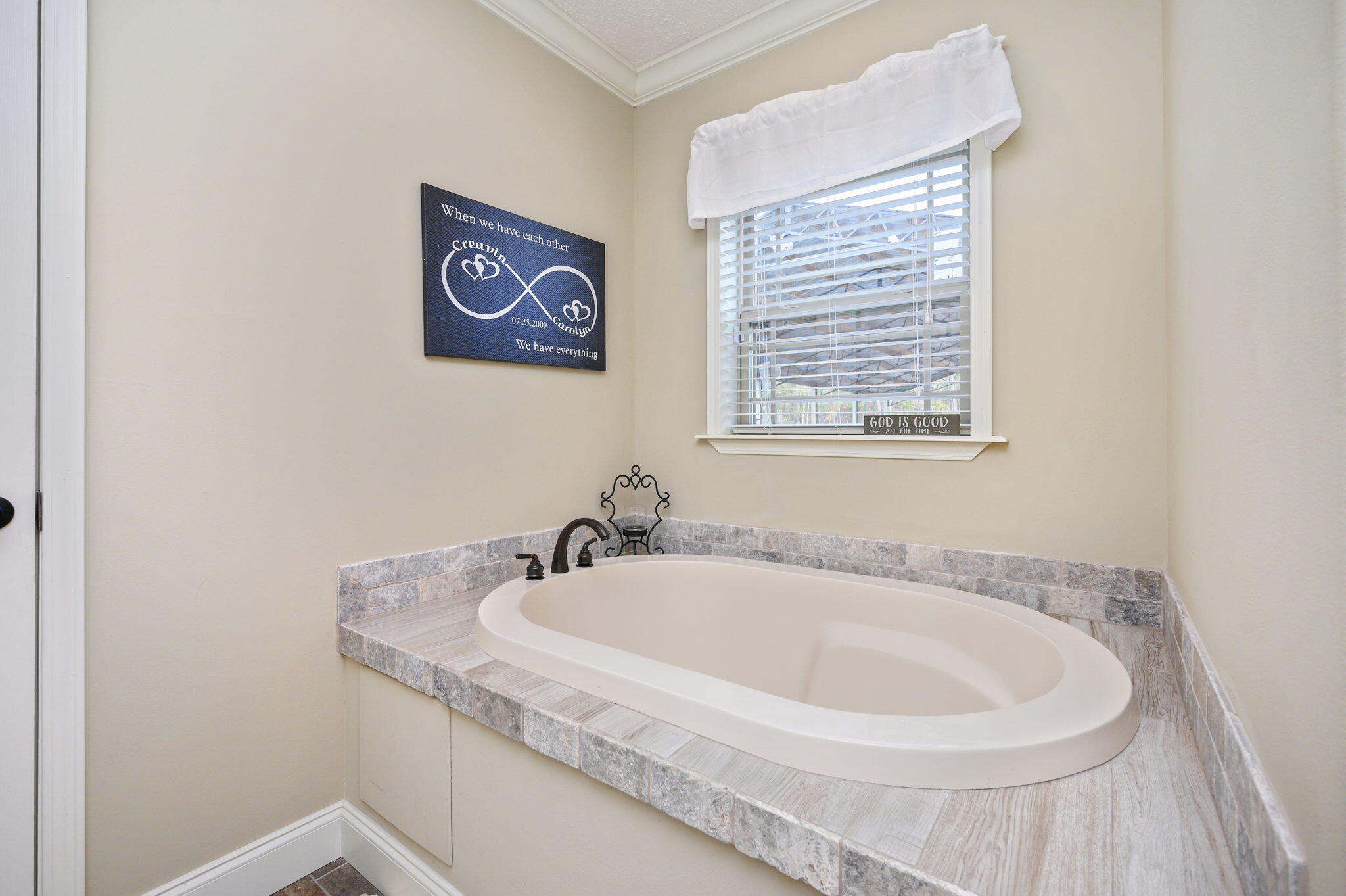 6019 Old River Road Baker, FL 32531 - Photo 23 of 54 a bath tub sitting next to a white sink