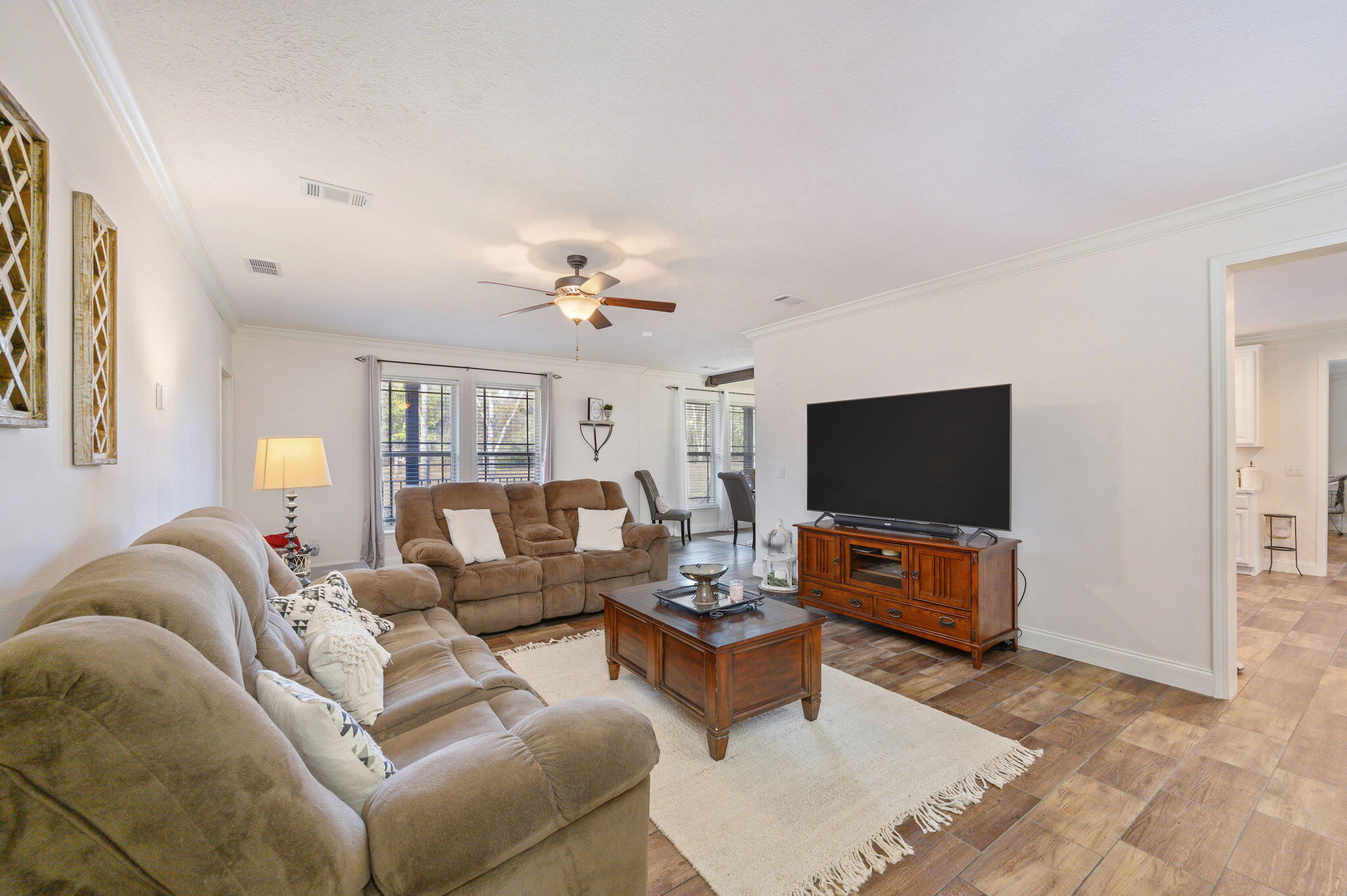 6019 Old River Road Baker, FL 32531 - Photo 26 of 54 a living room with furniture and a flat screen tv