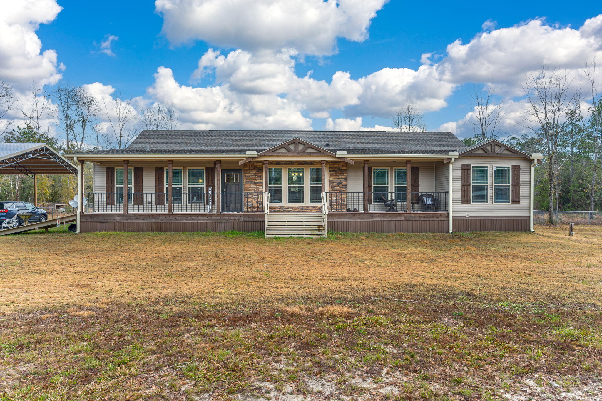 6019 Old River Road Baker, FL 32531 - Photo 3 of 54 a view of a house with a swimming pool