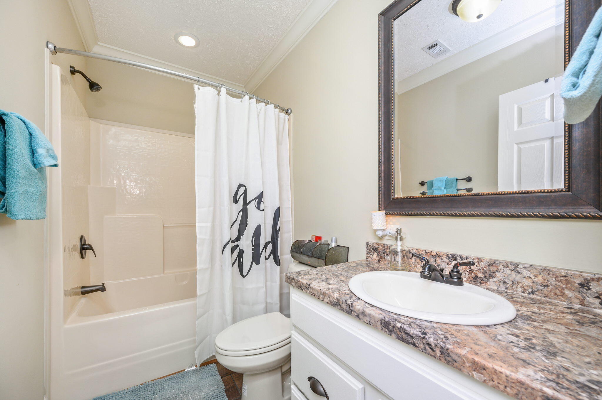 6019 Old River Road Baker, FL 32531 - Photo 34 of 54 a bathroom with a granite countertop sink toilet and shower