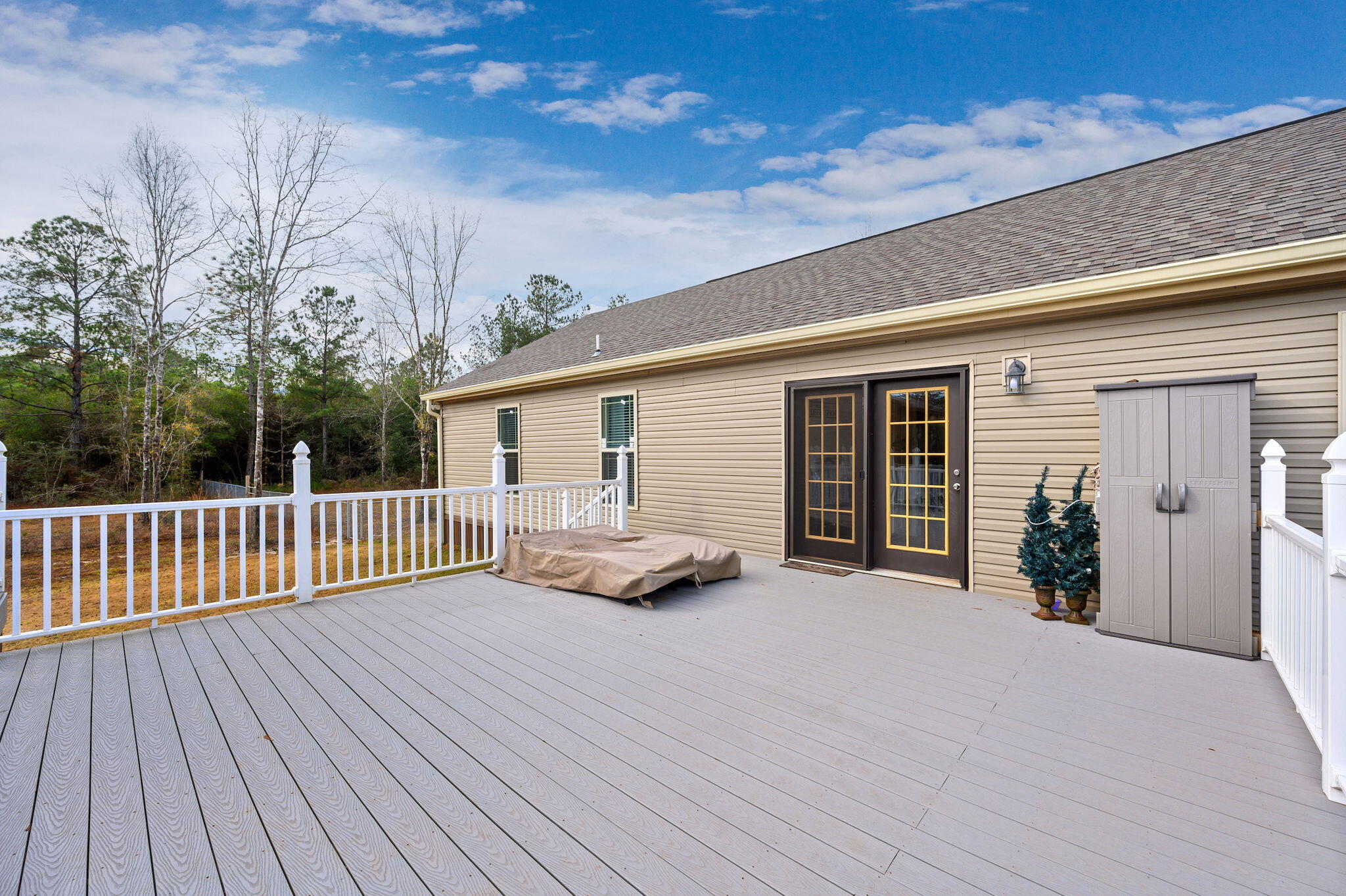 6019 Old River Road Baker, FL 32531 - Photo 44 of 54 a view of a house with a patio