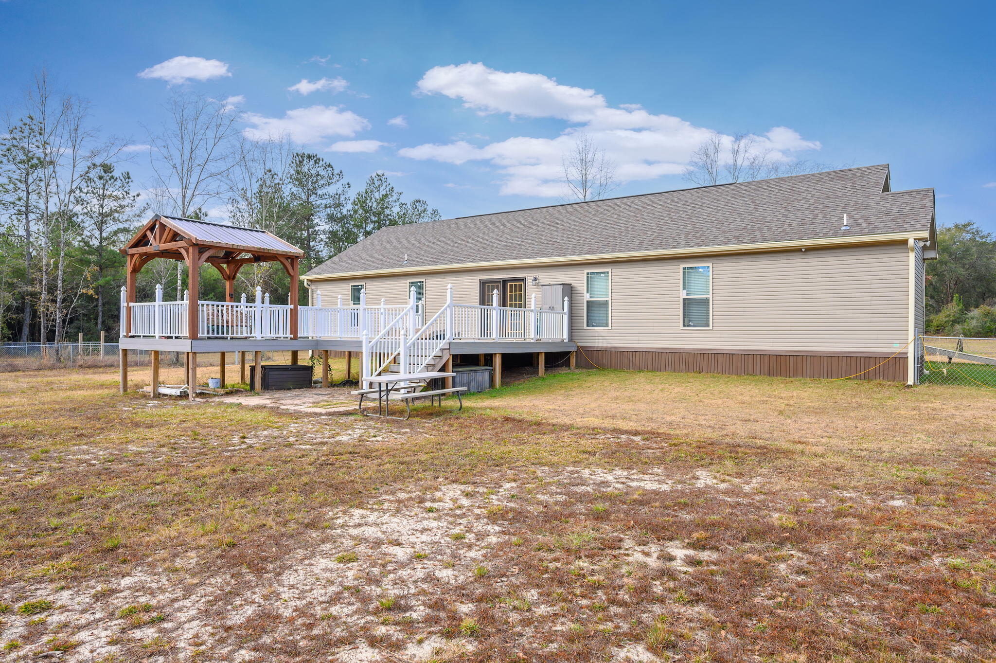6019 Old River Road Baker, FL 32531 - Photo 45 of 54 a view of a house with a yard and sitting area
