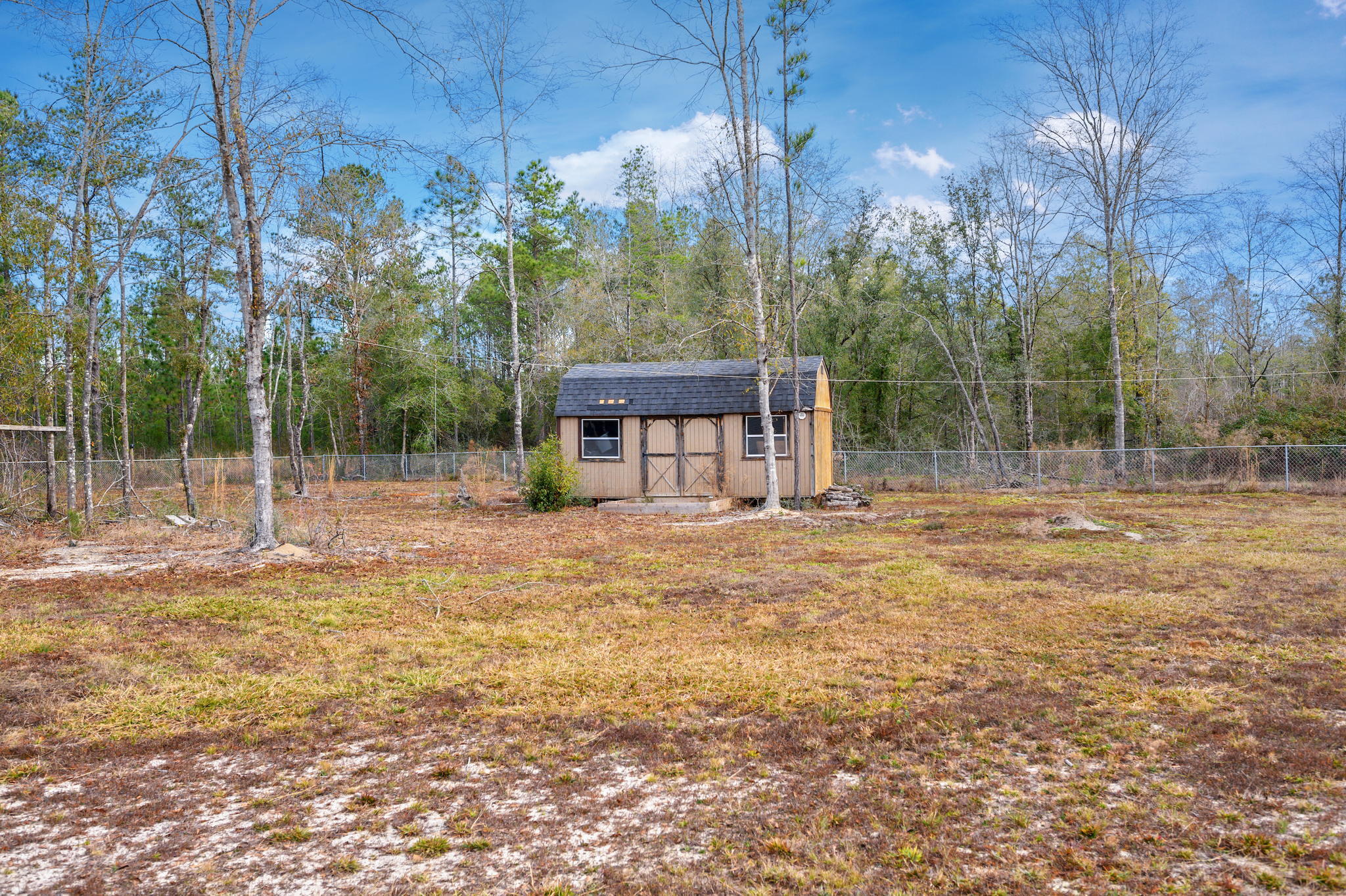 6019 Old River Road Baker, FL 32531 - Photo 46 of 54 a view of a house with backyard and trees