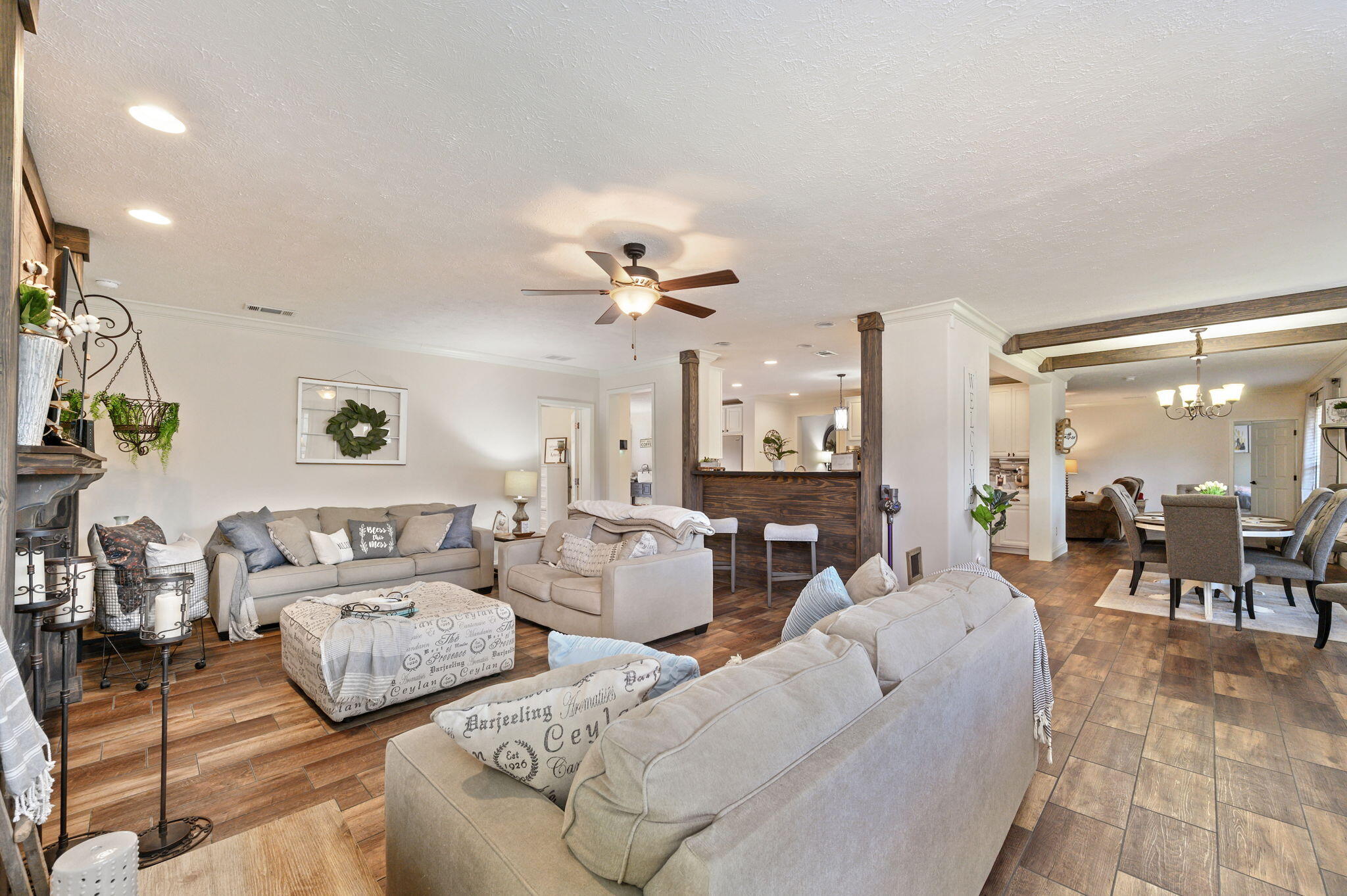 6019 Old River Road Baker, FL 32531 - Photo 8 of 54 a living room with couches and kitchen view with wooden floor