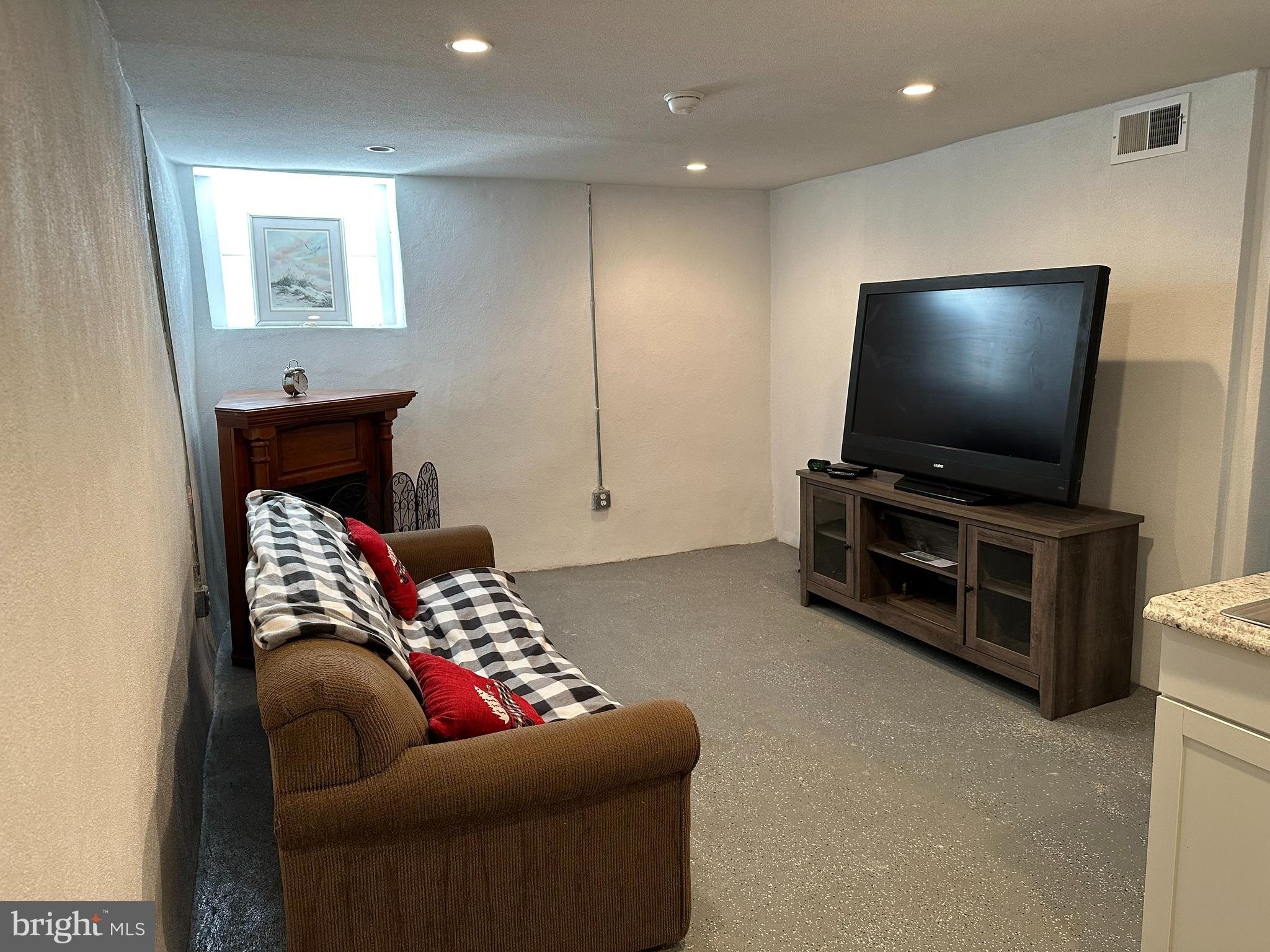 3 Harvin Road Upper Darby, PA 19082 - Photo 12 of 17 a living room with furniture and a flat screen tv