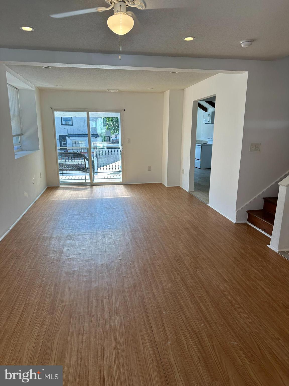 3 Harvin Road Upper Darby, PA 19082 - Photo 4 of 17 a view of an empty room with a window and wooden floor