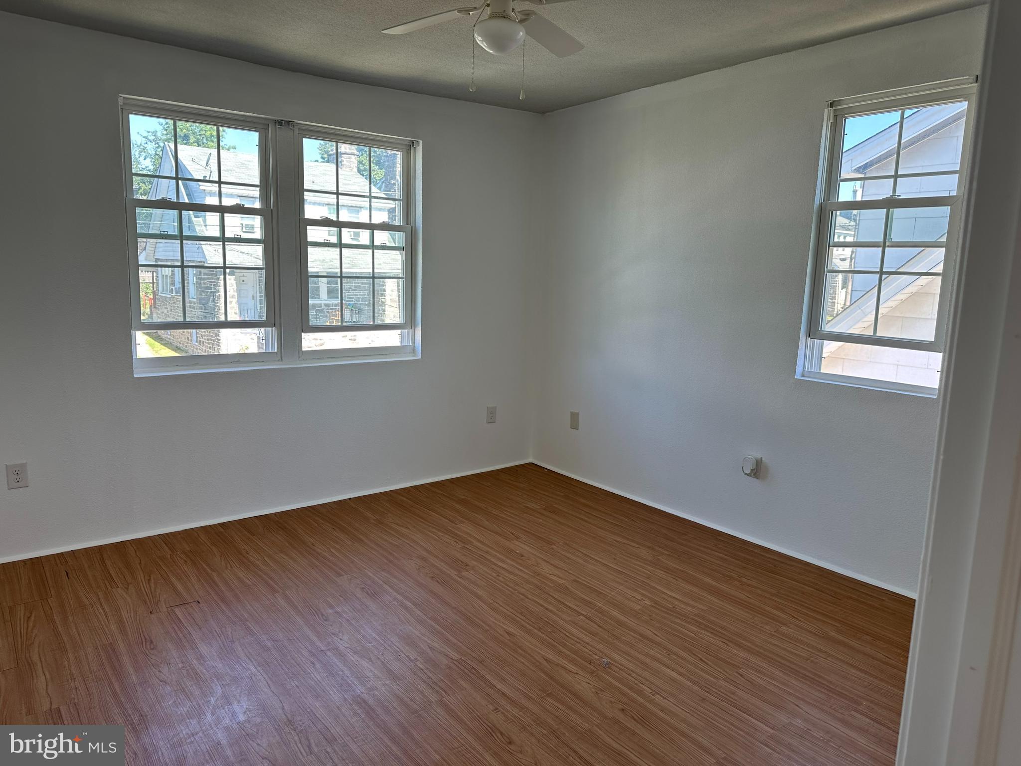 3 Harvin Road Upper Darby, PA 19082 - Photo 9 of 17 an empty room with wooden floor and windows