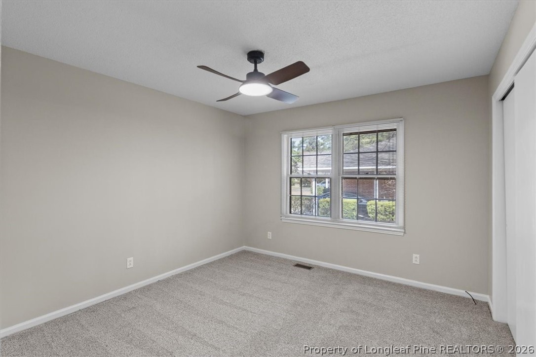 630 Bedford Road Fayetteville, NC 28303 - Photo 17 of 21 an empty room with a window and a fan