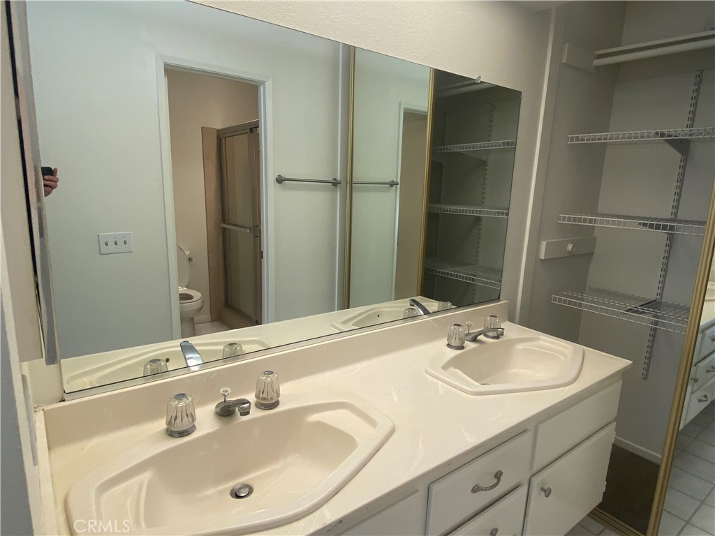 104 Costero Aisle, Unit 290 Irvine, CA 92614 - Photo 11 of 14 a bathroom with a sink and a mirror