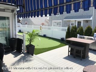 203 Helm Road Mantoloking, NJ 08738 - Photo 14 of 42 a view of a chairs and table in the patio