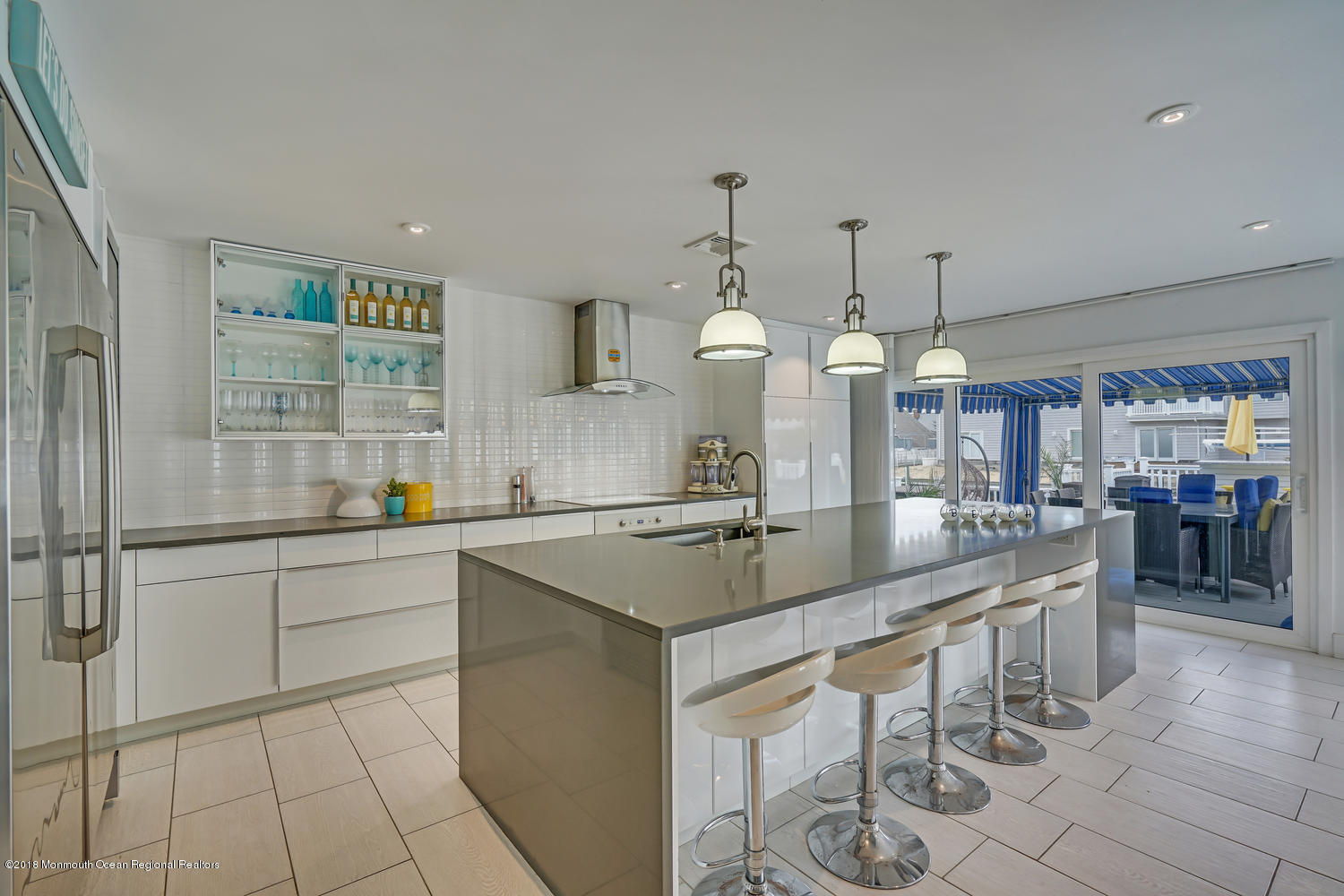 203 Helm Road Mantoloking, NJ 08738 - Photo 2 of 42 a kitchen with stainless steel appliances granite countertop a sink and a refrigerator