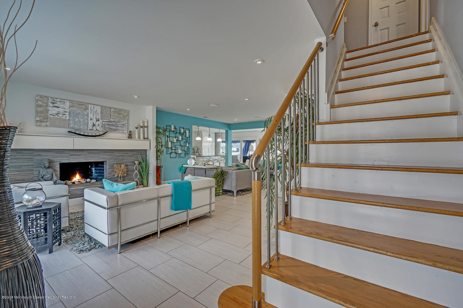 203 Helm Road Mantoloking, NJ 08738 - Photo 22 of 42 a living room with furniture and a fireplace