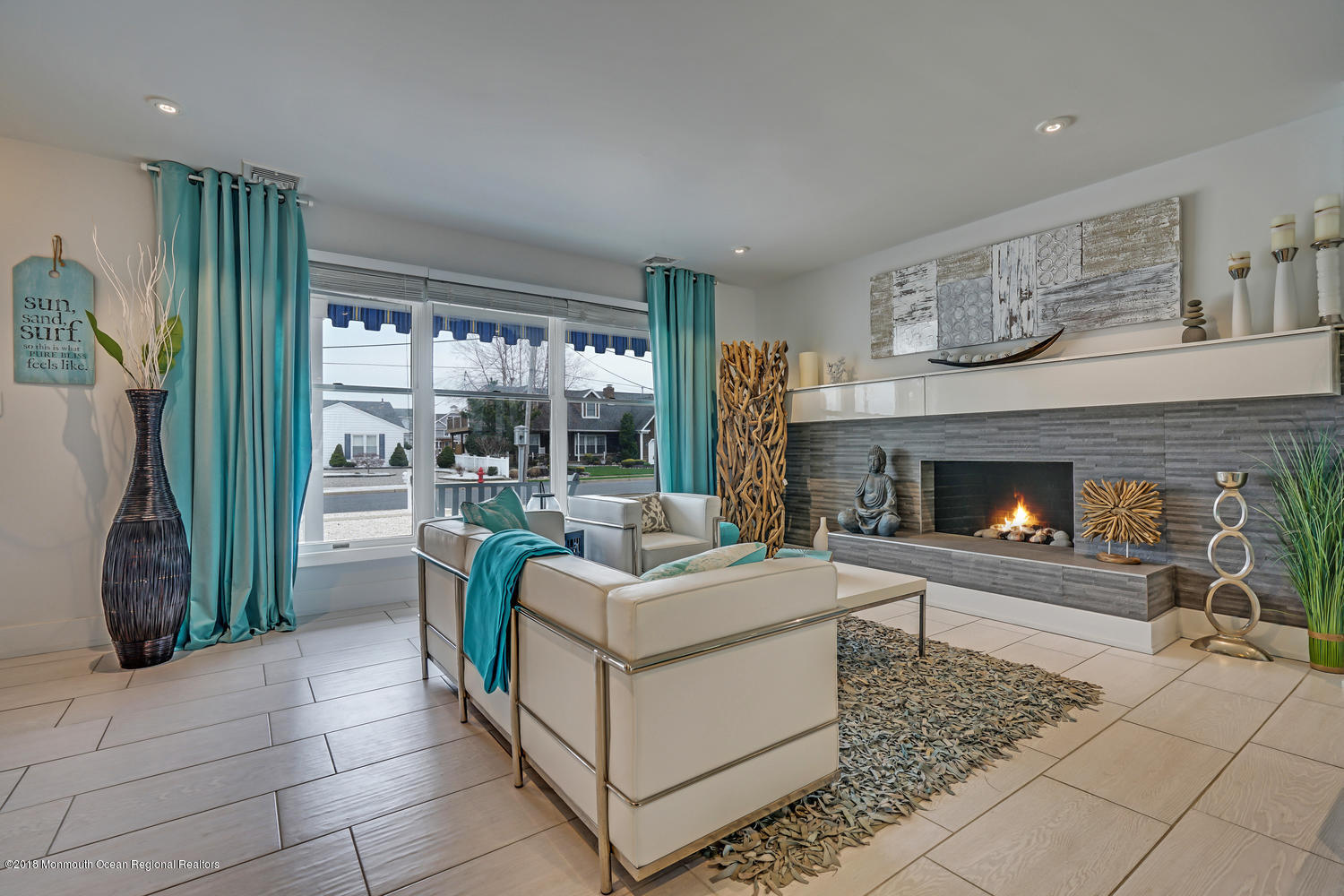 203 Helm Road Mantoloking, NJ 08738 - Photo 23 of 42 a living room with furniture and a fireplace