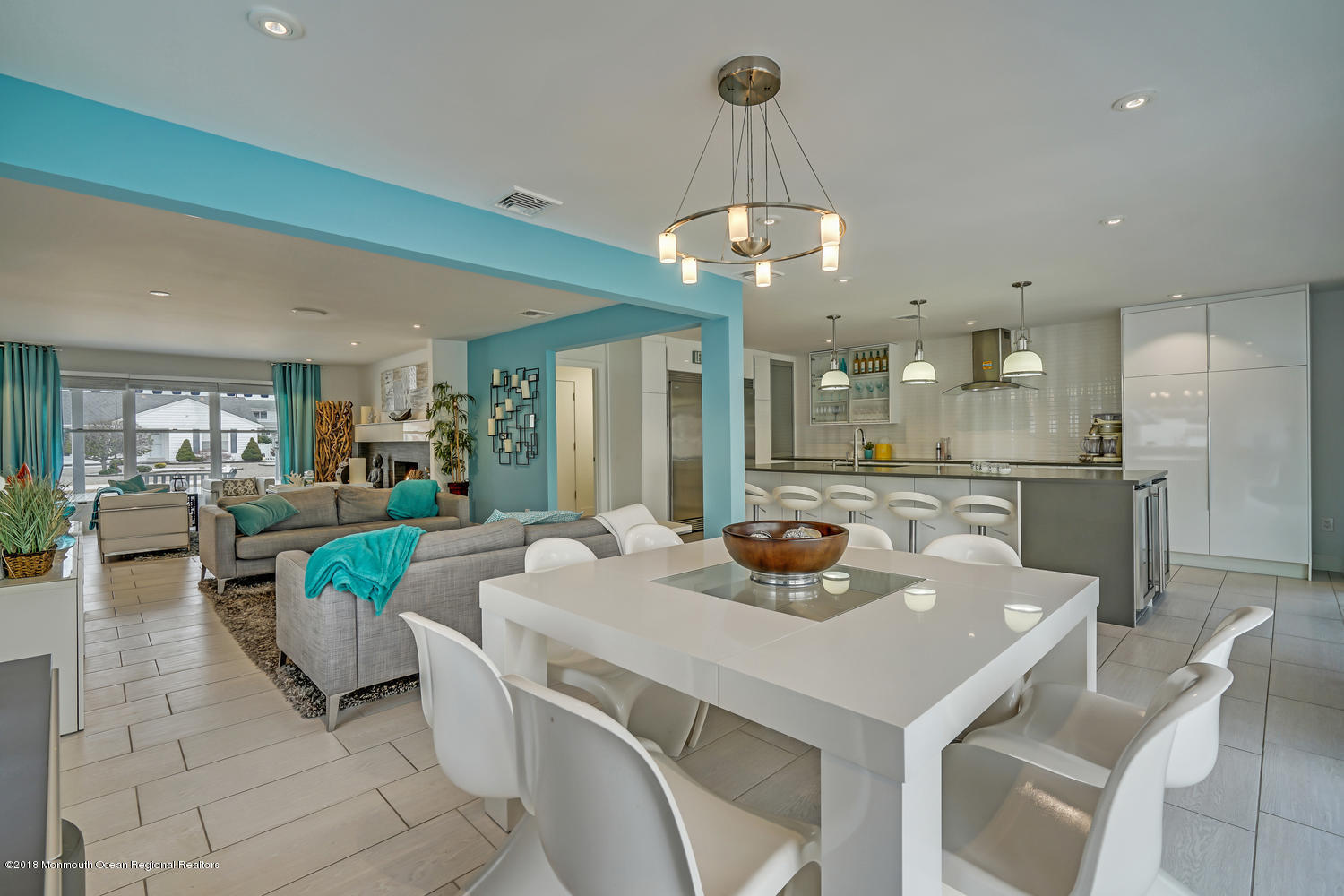 203 Helm Road Mantoloking, NJ 08738 - Photo 28 of 42 a view of a dining room and livingroom with furniture a chandelier and kitchen view
