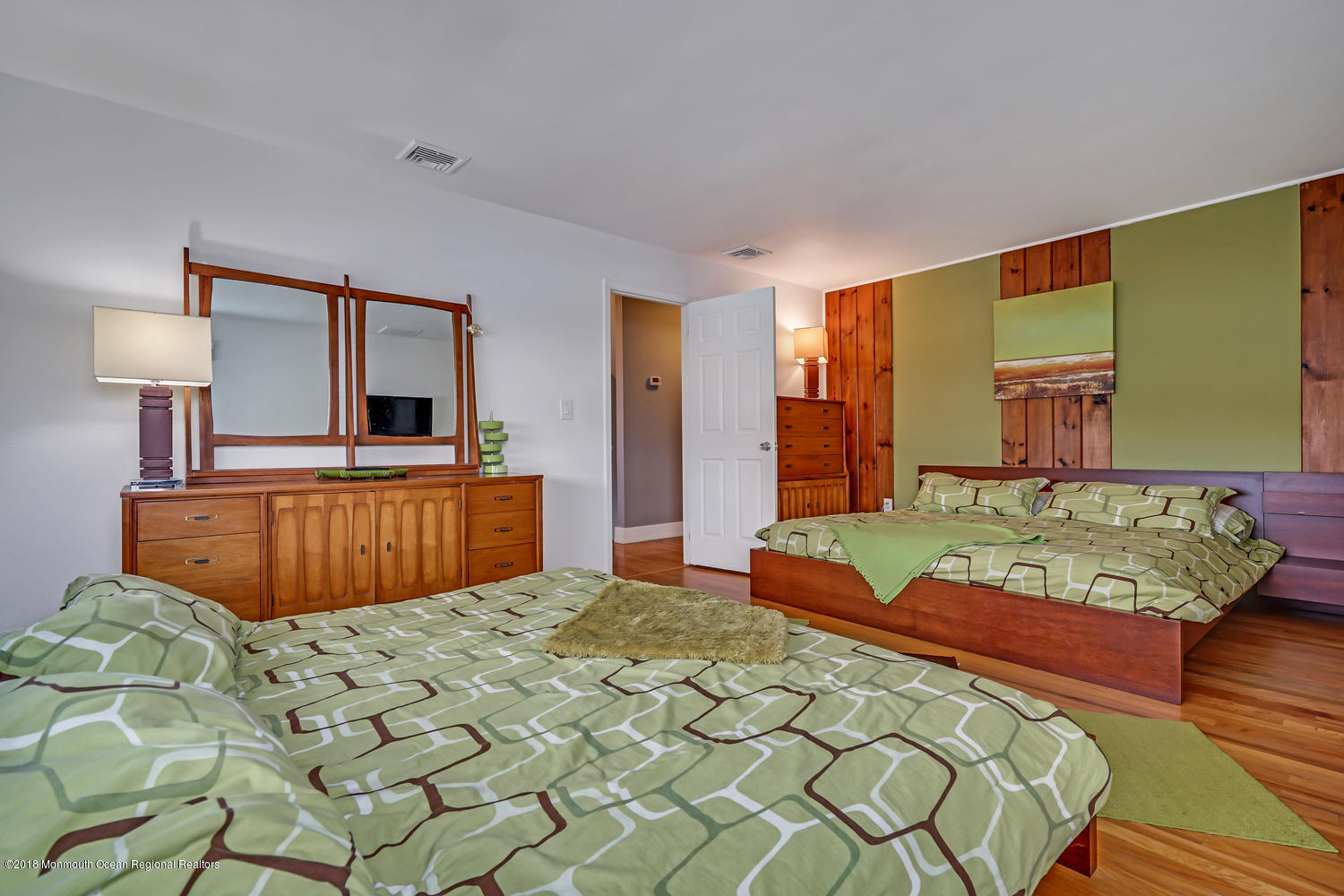 203 Helm Road Mantoloking, NJ 08738 - Photo 37 of 42 a bed room with a bed and a mirror