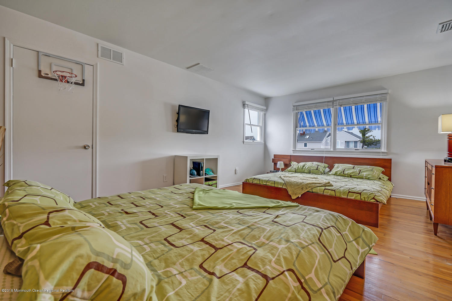 203 Helm Road Mantoloking, NJ 08738 - Photo 38 of 42 a bedroom with a bed and a flat screen tv