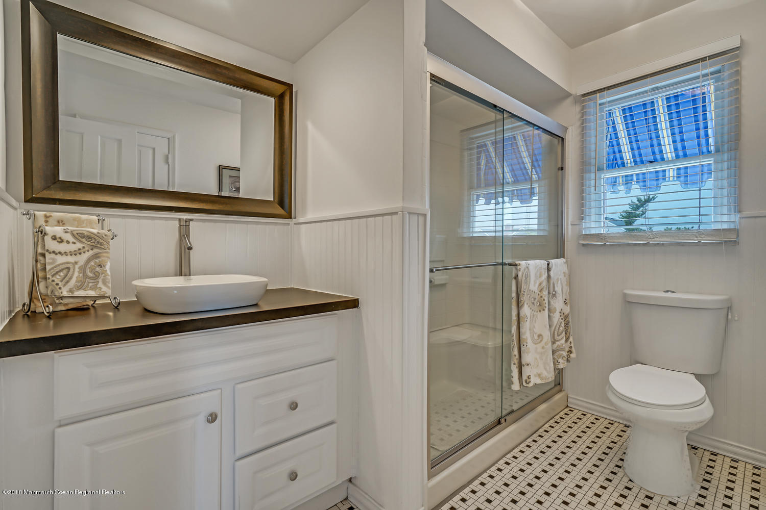 203 Helm Road Mantoloking, NJ 08738 - Photo 41 of 42 a bathroom with a toilet a sink and mirror
