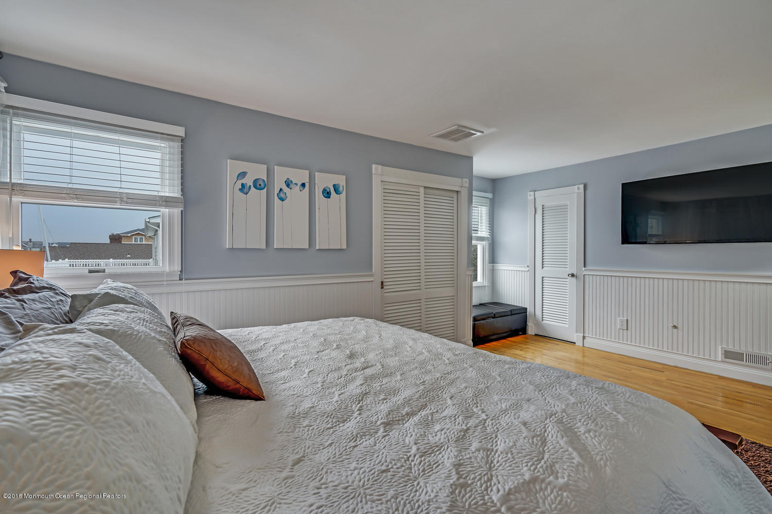 203 Helm Road Mantoloking, NJ 08738 - Photo 42 of 42 a bedroom with a large bed and a flat screen tv
