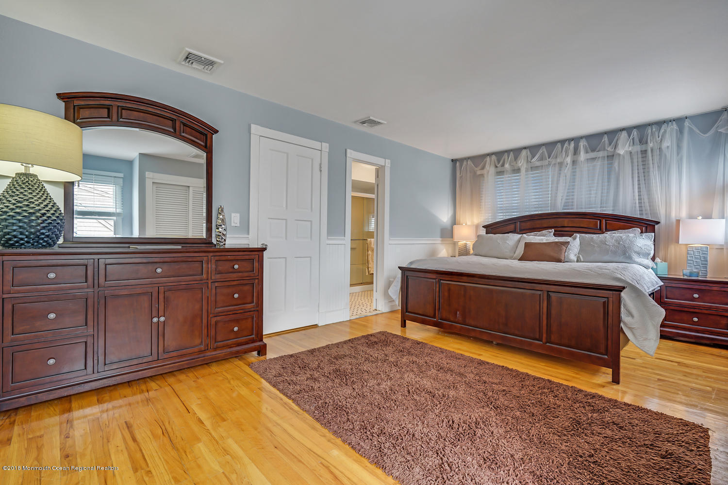 203 Helm Road Mantoloking, NJ 08738 - Photo 5 of 42 a bedroom with a bed and a dresser