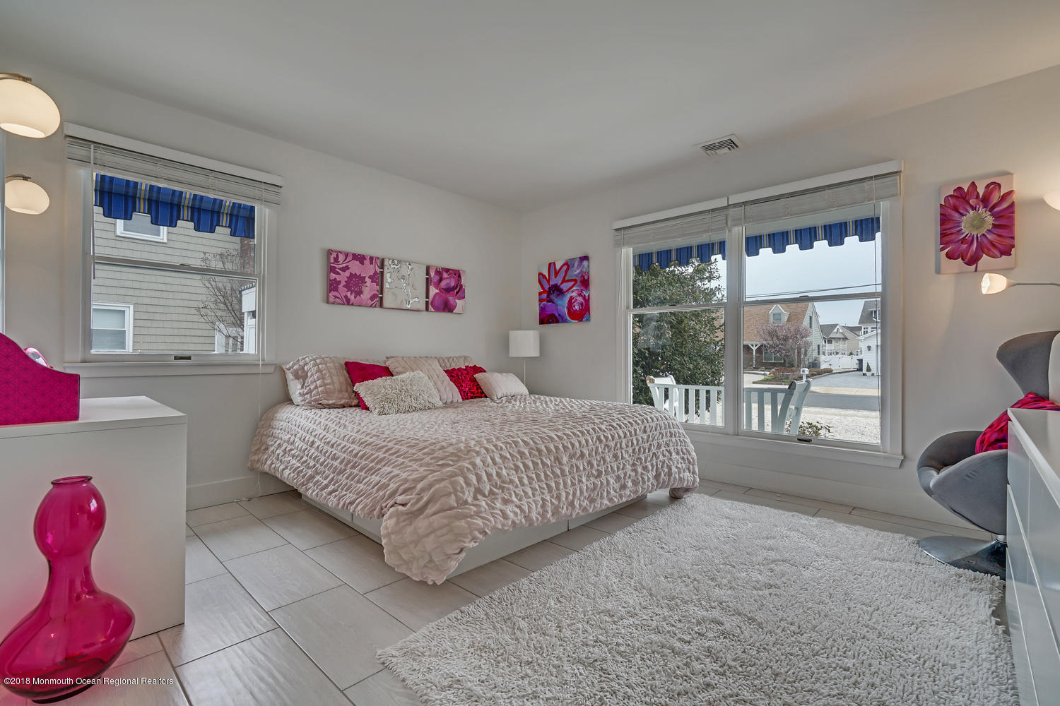 203 Helm Road Mantoloking, NJ 08738 - Photo 6 of 42 a bedroom with a bed and wooden floor