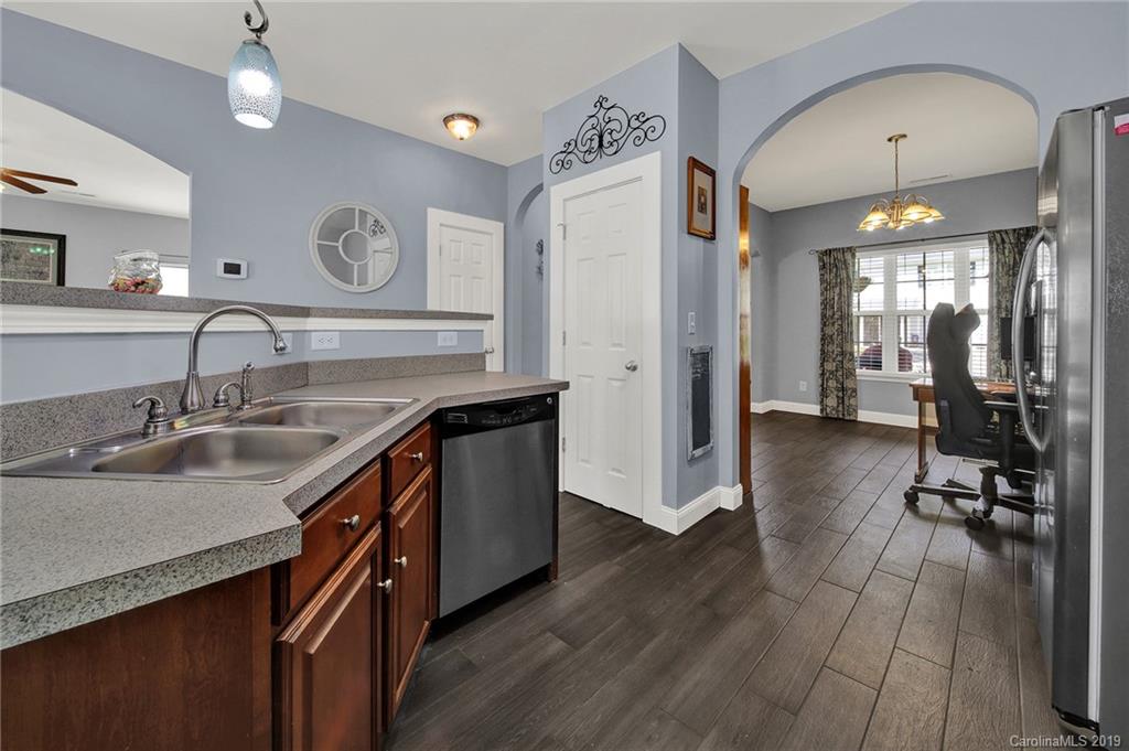 778 Jones Branch Road Fort Mill, SC 29715 - Photo 12 of 44 a kitchen with sink cabinets and wooden floor