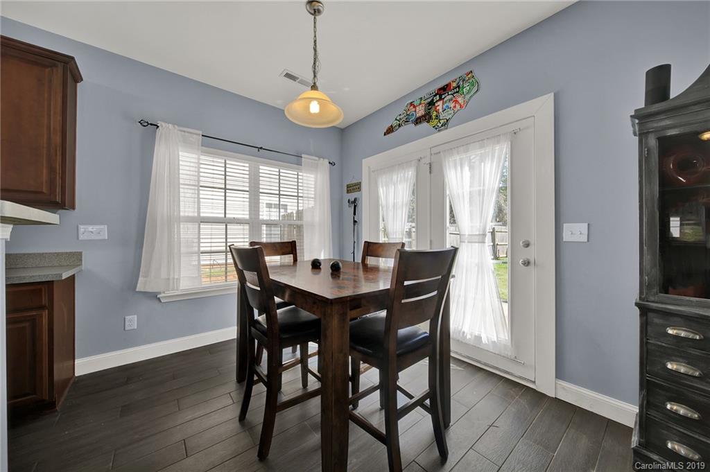 778 Jones Branch Road Fort Mill, SC 29715 - Photo 13 of 44 a view of a dining room with furniture window and wooden floor