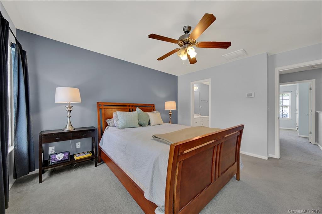 778 Jones Branch Road Fort Mill, SC 29715 - Photo 20 of 44 a bedroom with a bed and a chandelier