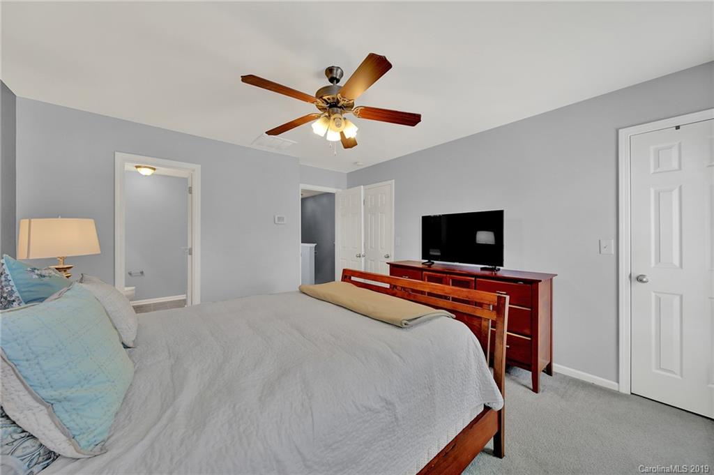 778 Jones Branch Road Fort Mill, SC 29715 - Photo 22 of 44 a bedroom with a bed and a flat screen tv