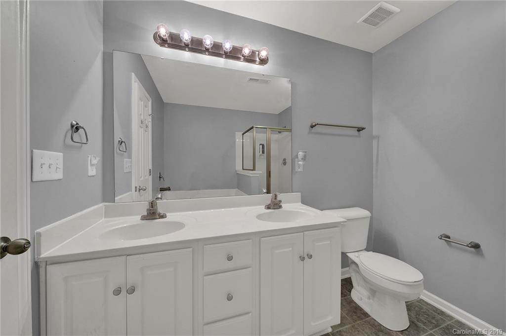 778 Jones Branch Road Fort Mill, SC 29715 - Photo 23 of 44 a bathroom with a toilet sink and mirror