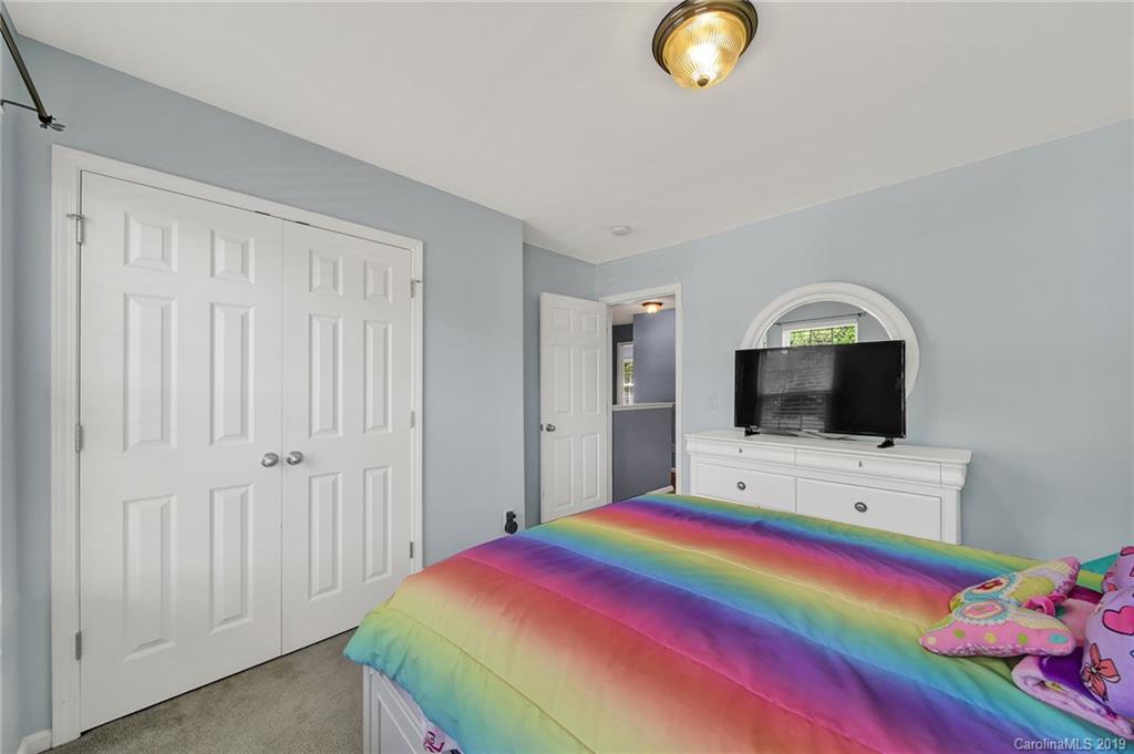 778 Jones Branch Road Fort Mill, SC 29715 - Photo 27 of 44 a bedroom with a bed and a flat screen tv