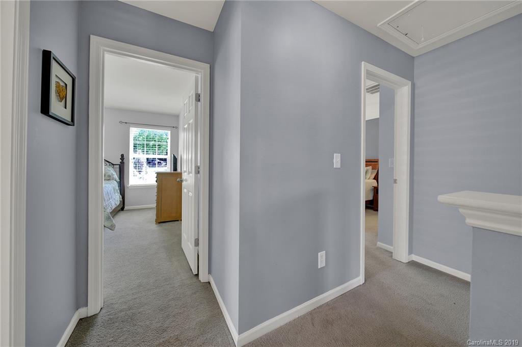 778 Jones Branch Road Fort Mill, SC 29715 - Photo 28 of 44 a view of a hallway with a livingroom and a livingroom with furniture
