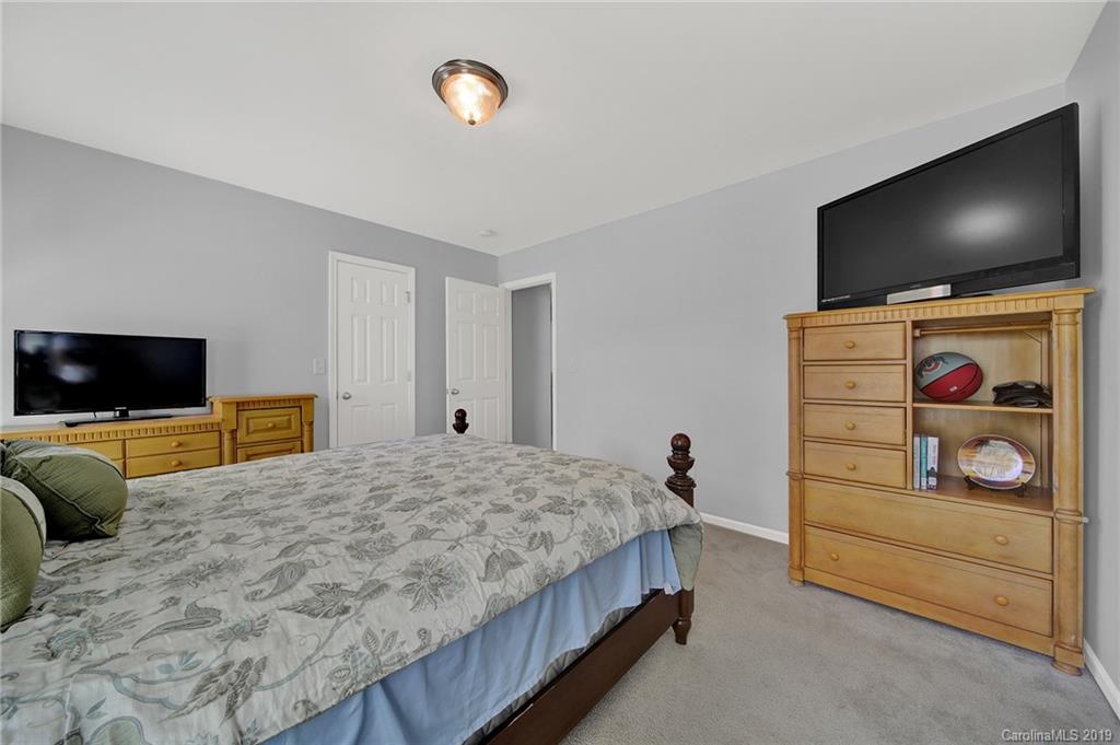 778 Jones Branch Road Fort Mill, SC 29715 - Photo 30 of 44 a bedroom with bed and a flat screen tv