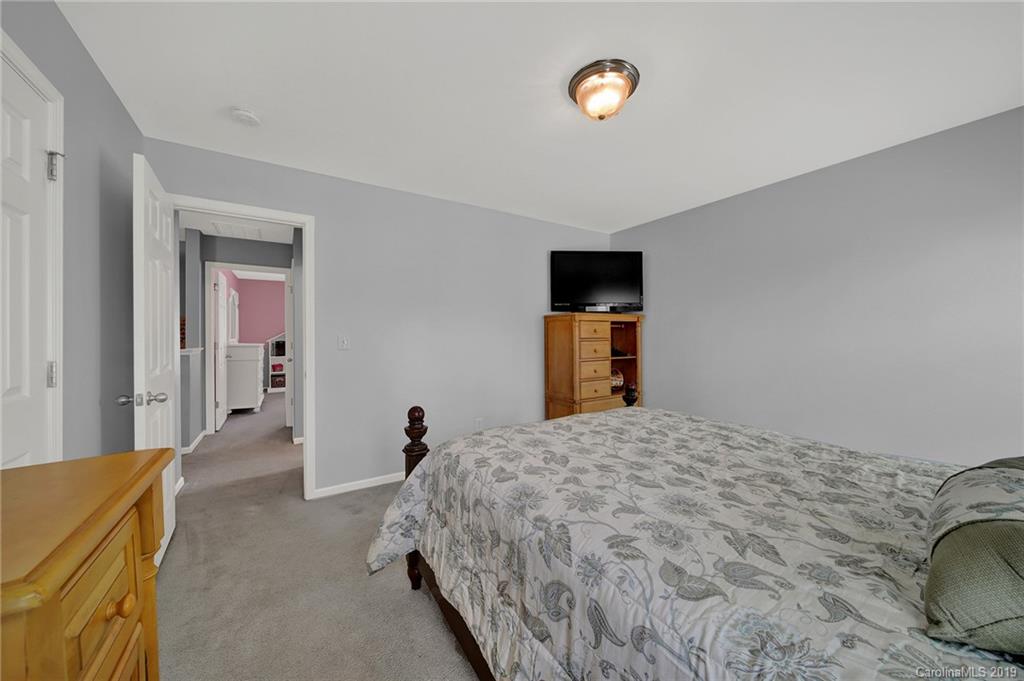 778 Jones Branch Road Fort Mill, SC 29715 - Photo 31 of 44 a bedroom with a bed and a cabinets