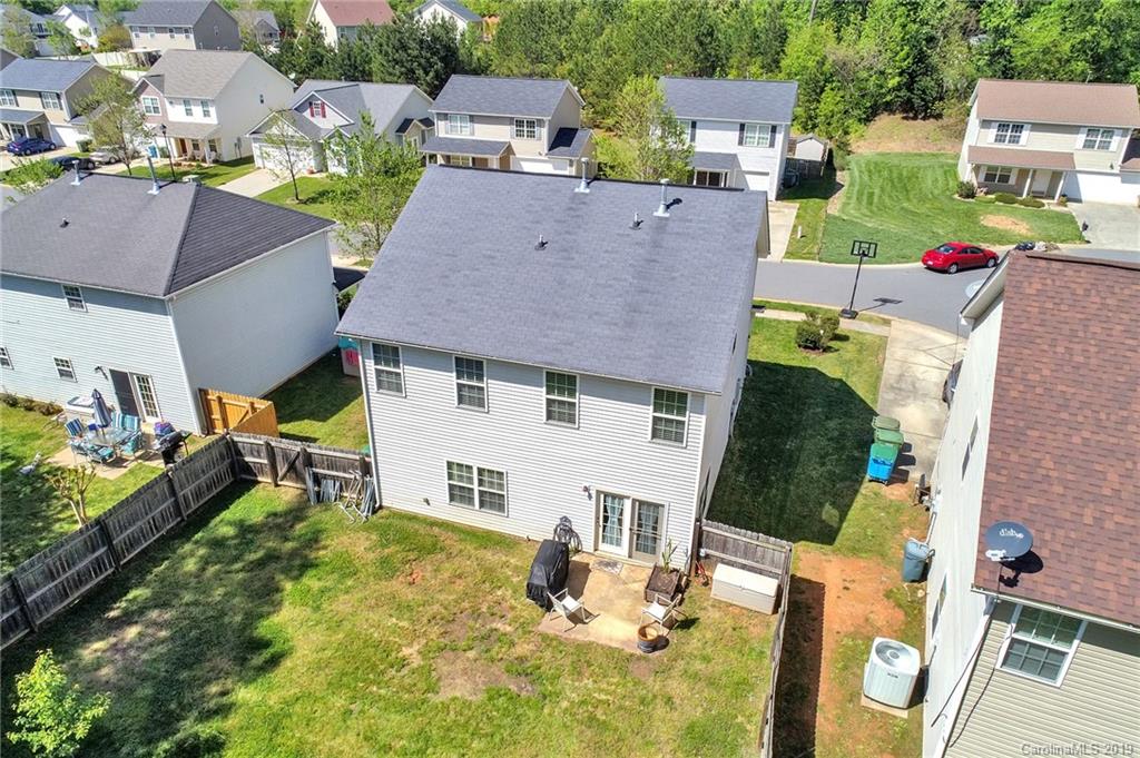 778 Jones Branch Road Fort Mill, SC 29715 - Photo 41 of 44 an aerial view of a house with swimming pool and large trees