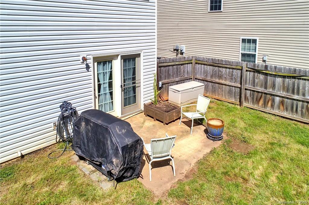 778 Jones Branch Road Fort Mill, SC 29715 - Photo 43 of 44 a view of a patio with table and chairs and wooden floor