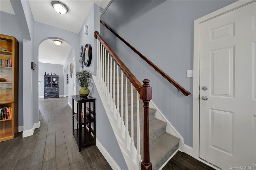 778 Jones Branch Road Fort Mill, SC 29715 - Photo 7 of 44 a view of entryway and hall with wooden floor