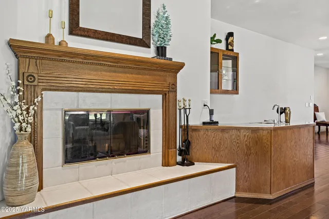 a bathroom with a sink a large mirror and a bathtub