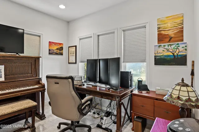 a living room with furniture and a gate