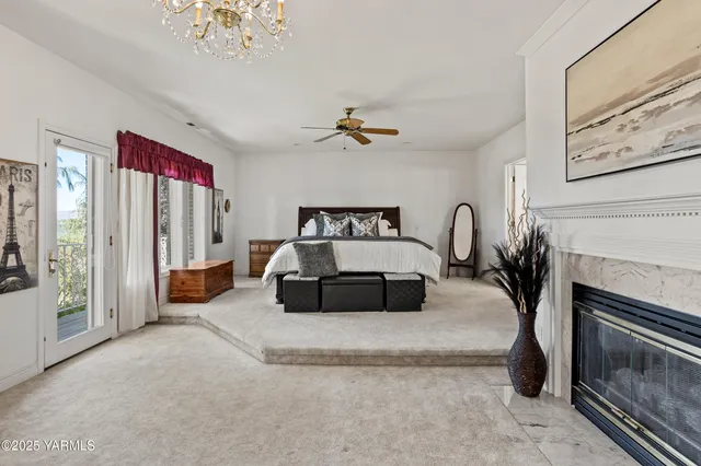 a living room with furniture and white walls next to a window