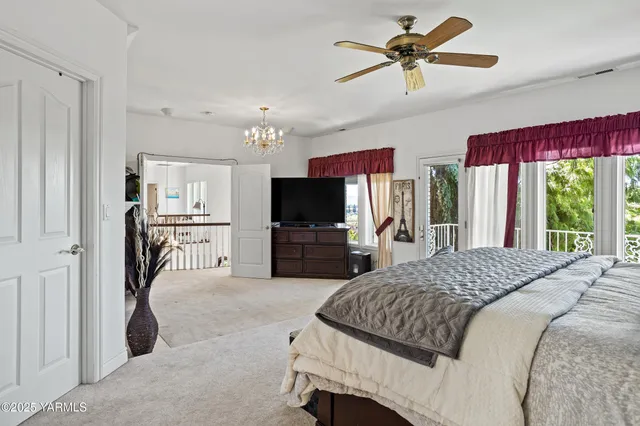 a view of a chairs and table in the balcony