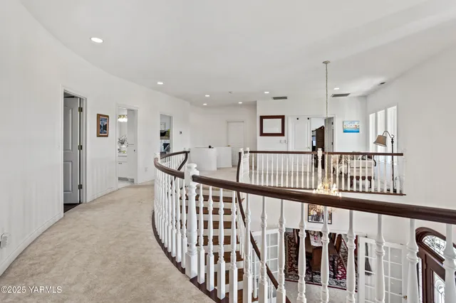 a view of a swimming pool with a table and chairs