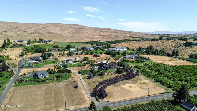 a view of swimming pool with outdoor seating and city view
