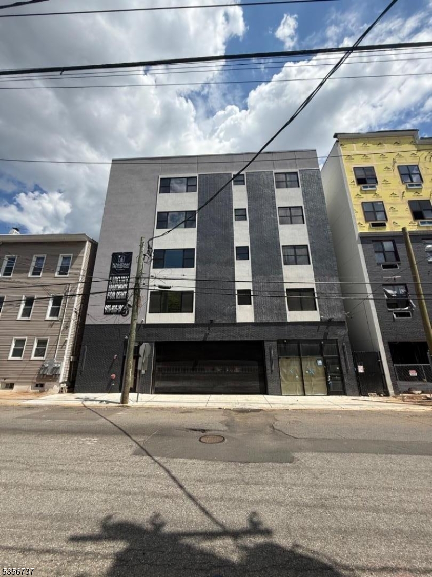 261 Marshall Street, Unit 504 Paterson, NJ 07503 - Photo 1 of 7 a front view of a building