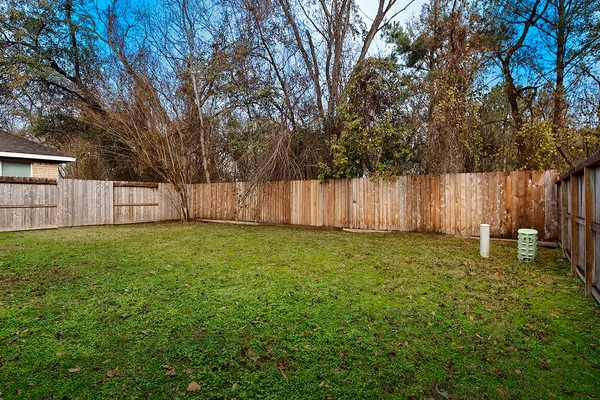 a backyard of a house with lots of green space