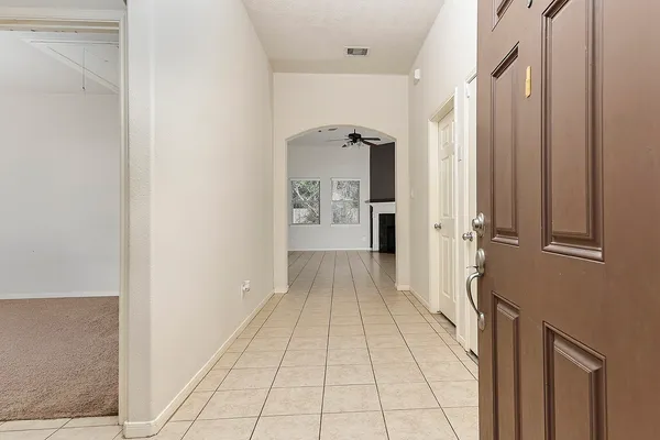 a view of a hallway with a livingroom