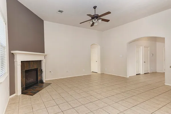 a view of an empty room with a fireplace
