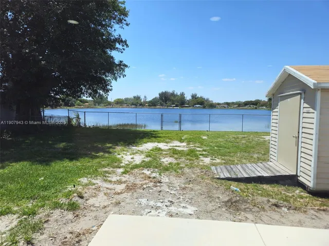 a view of a back yard of a house