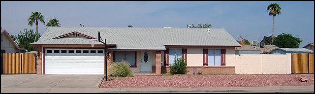 7138 West Hatcher Road Peoria, AZ 85345 - Photo 18 of 18 Front of home with dual RV gates