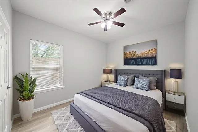 a bedroom with a bed and a window